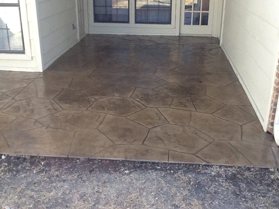 Decorative stamped concrete back patio and grill area in Allen TX