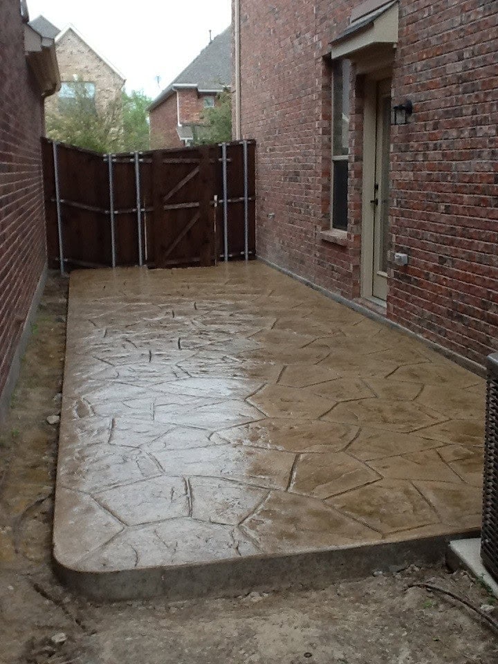 Decorative stamped concrete patio in McKinney Texas backyard